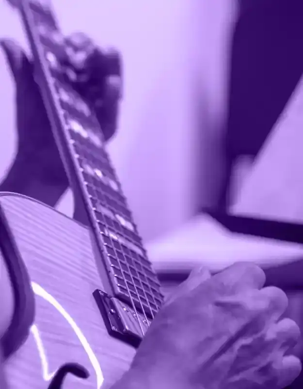Guitar student learning to solo on their instrument